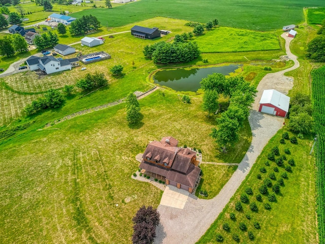 birds eye view of property with a rural view and a water view