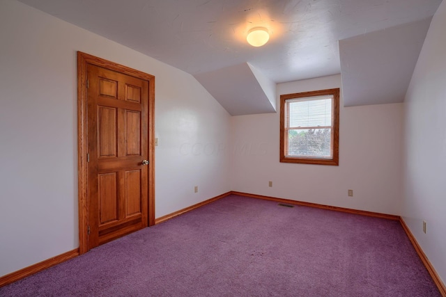 bonus room with carpet and lofted ceiling