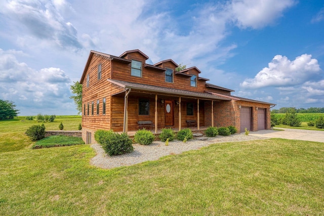 log-style house with covered porch, a garage, and a front yard