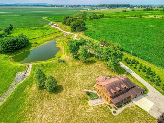 drone / aerial view featuring a rural view and a water view