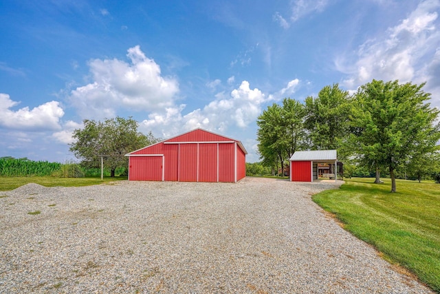 view of outbuilding with a yard