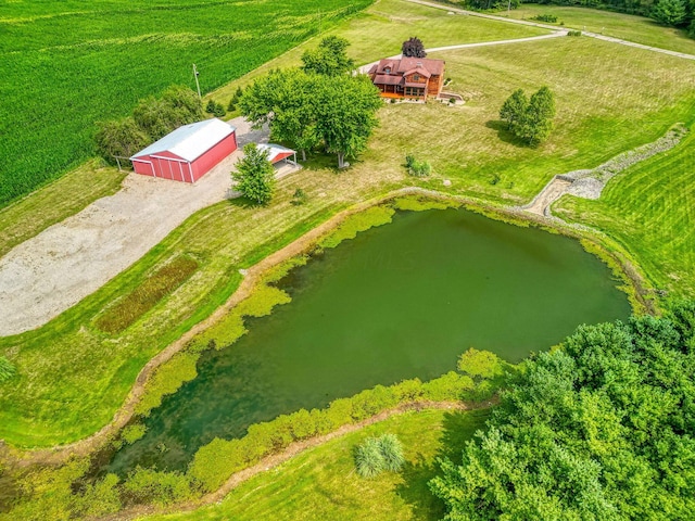 birds eye view of property with a water view and a rural view