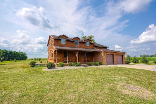 view of front facade with a front lawn, a porch, and a garage