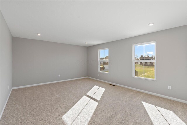 empty room featuring light colored carpet