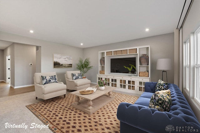 carpeted living room featuring a healthy amount of sunlight