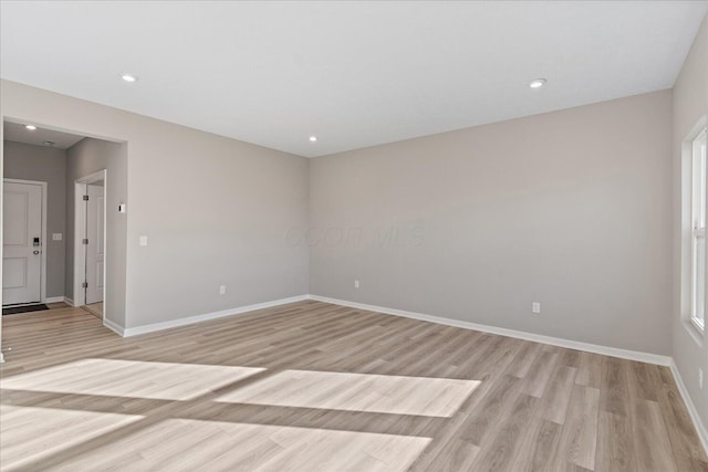 empty room with light wood-type flooring