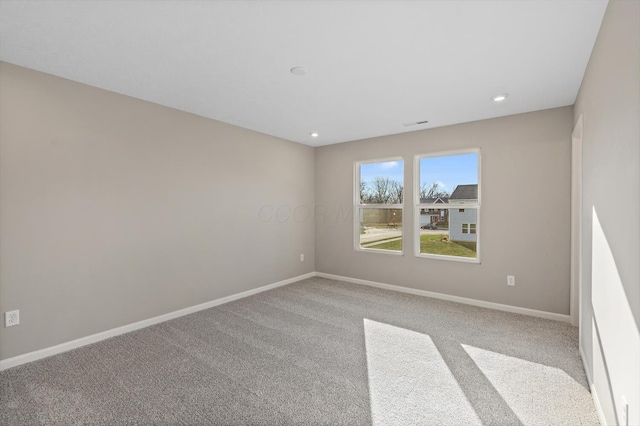 empty room featuring light colored carpet