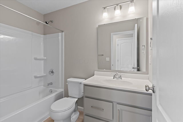 full bathroom with shower / tub combination, vanity, and toilet