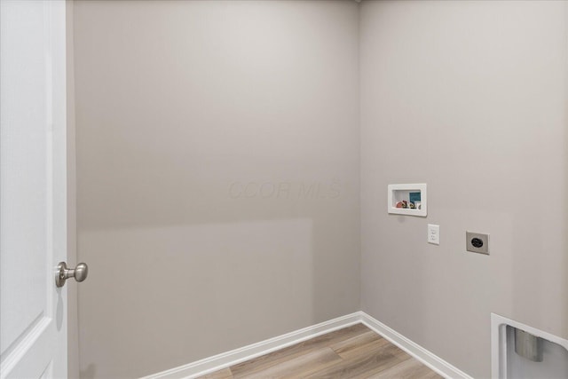 clothes washing area with washer hookup, light wood-type flooring, and electric dryer hookup