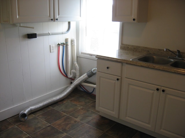 interior space featuring cabinets, washer hookup, and sink