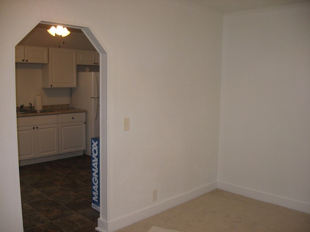 kitchen with white refrigerator and sink