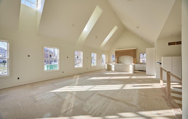 additional living space with a wealth of natural light and high vaulted ceiling