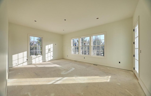 spare room featuring plenty of natural light