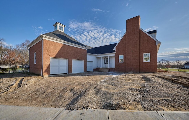 view of side of property featuring a garage