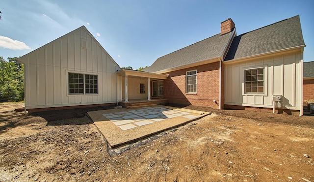 back of house with a patio