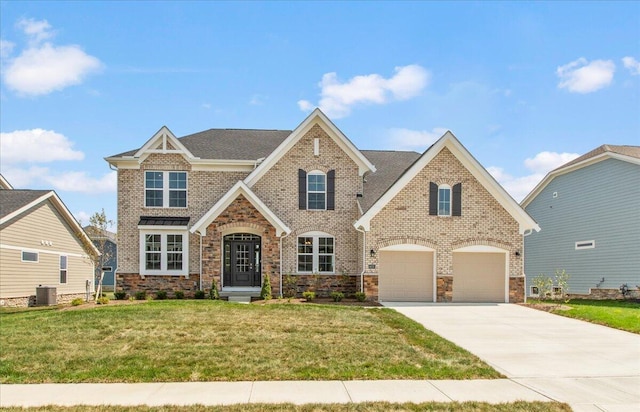 view of front of house featuring central air condition unit, a front lawn, and a garage