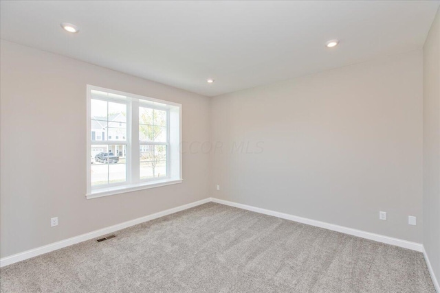 empty room featuring carpet floors