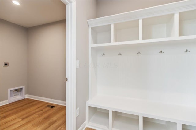 mudroom with hardwood / wood-style floors