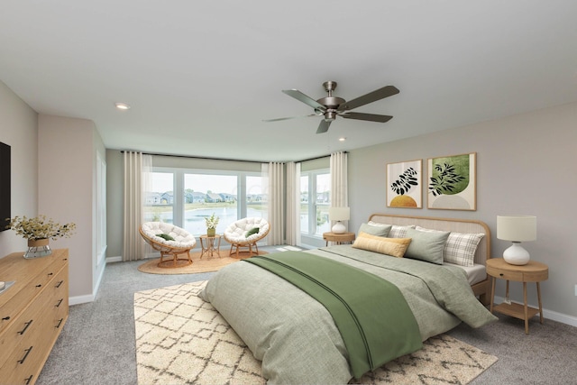 carpeted bedroom with ceiling fan and a water view