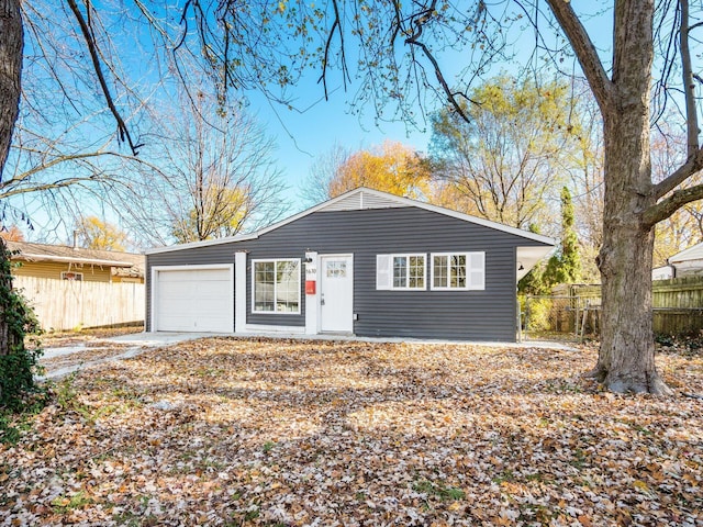 ranch-style home featuring a garage