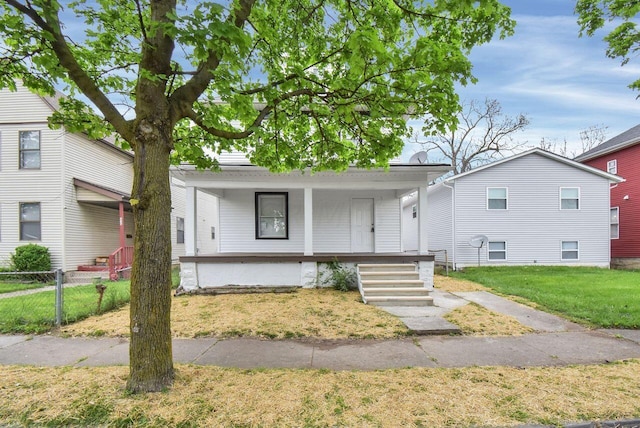 view of front of house with a front lawn and covered porch