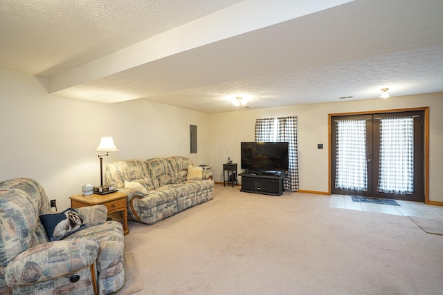 living room with carpet floors, a textured ceiling, electric panel, and french doors