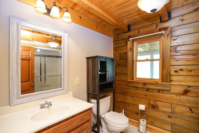 bathroom featuring vanity, wooden ceiling, a shower with door, toilet, and beamed ceiling