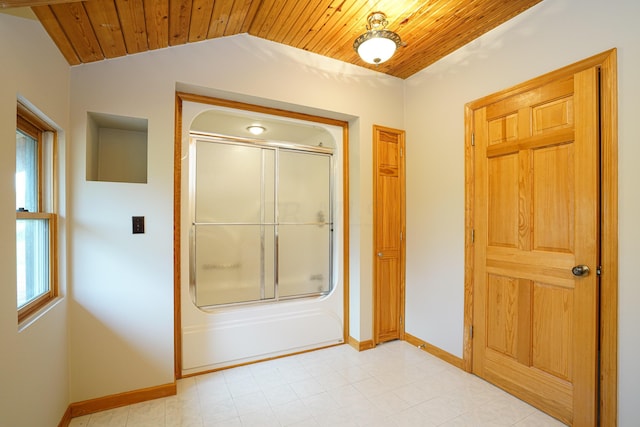 bathroom featuring wooden ceiling, lofted ceiling, and enclosed tub / shower combo