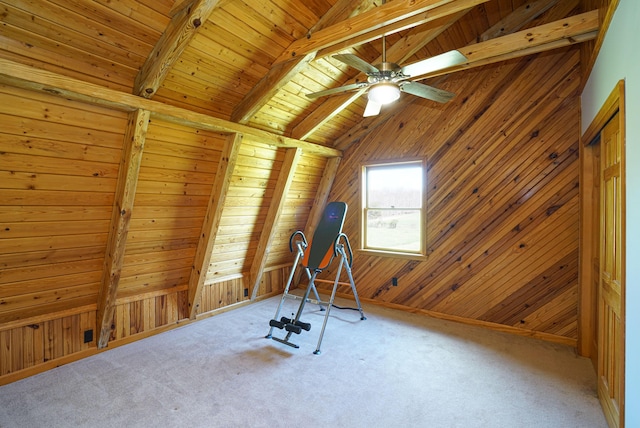 workout room with carpet floors, wooden ceiling, and wood walls