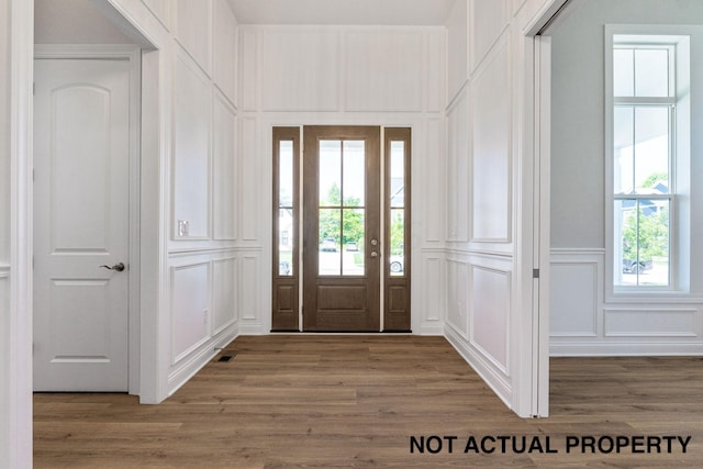 foyer featuring hardwood / wood-style floors and a wealth of natural light