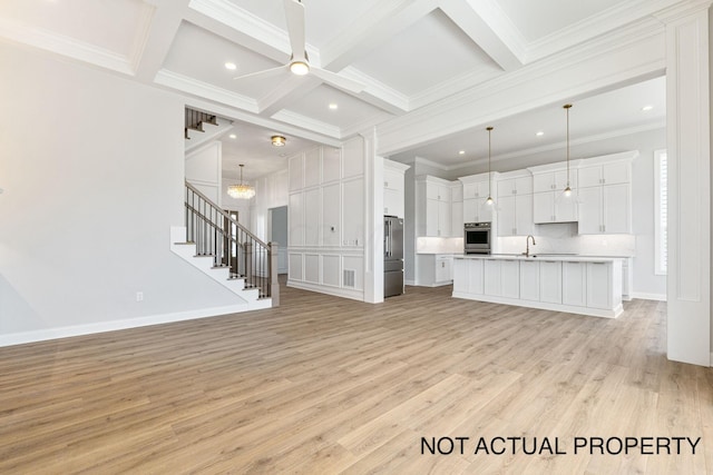 unfurnished living room with coffered ceiling, sink, ornamental molding, beamed ceiling, and light hardwood / wood-style floors