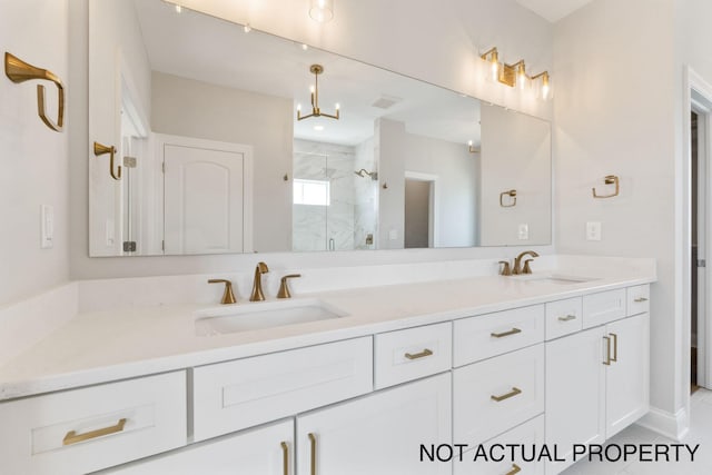 bathroom with tile patterned floors, vanity, and walk in shower