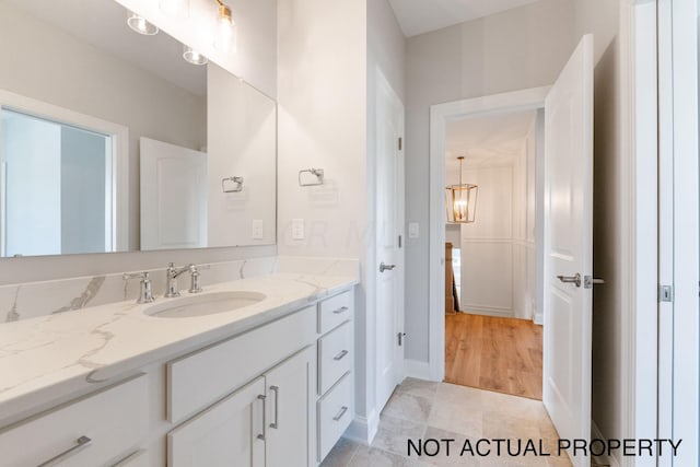 bathroom featuring hardwood / wood-style floors and vanity