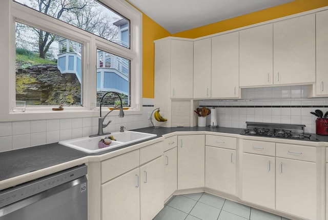 6730 Dublin Rd, Dublin, OH 43017 - kitchen with dishwasher, a healthy amount of sunlight, light tile patterned floors, and sink
