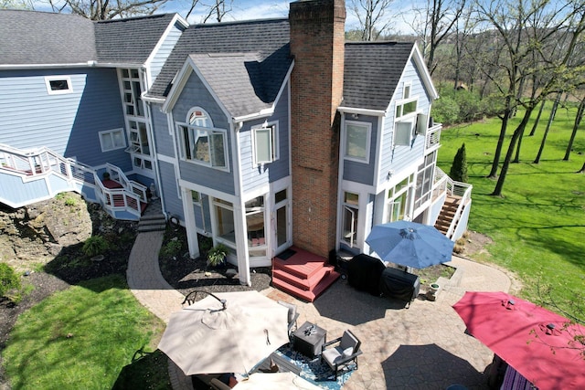 6730 Dublin Rd, Dublin, OH 43017 - back of property featuring a patio area and a lawn