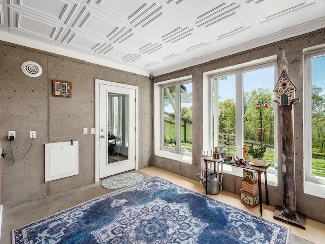 sunroom with plenty of natural light and coffered ceiling