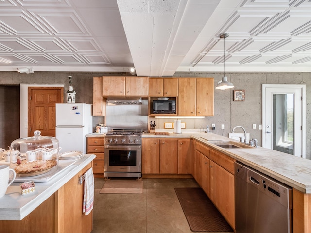 kitchen with sink, hanging light fixtures, and appliances with stainless steel finishes