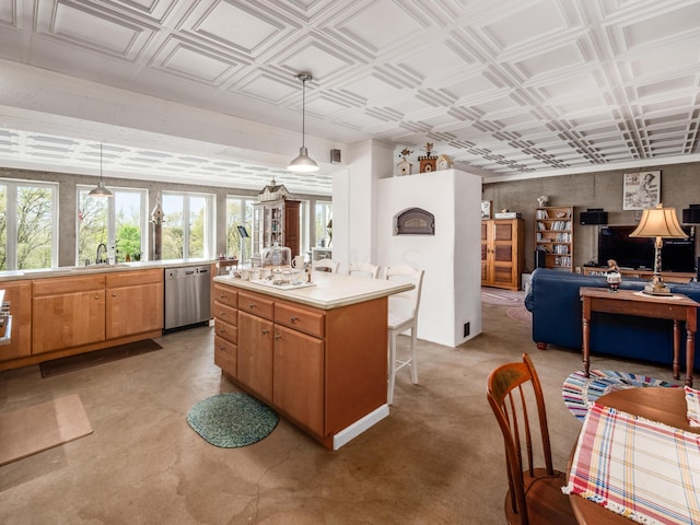 kitchen with dishwasher, an island with sink, pendant lighting, and sink