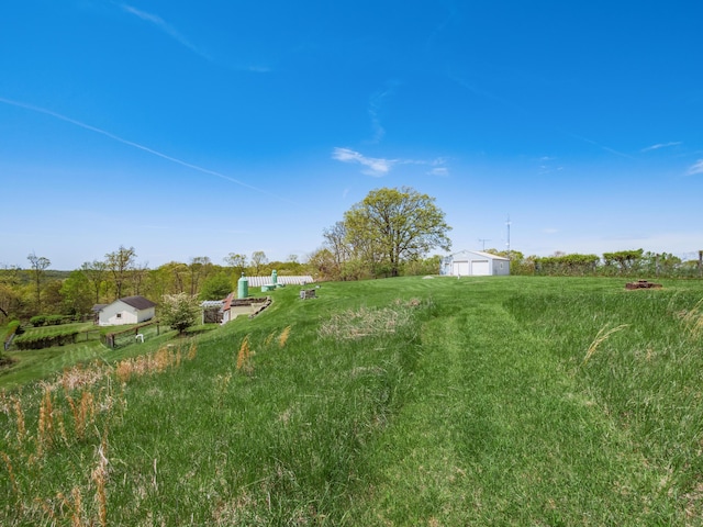 view of yard with a rural view