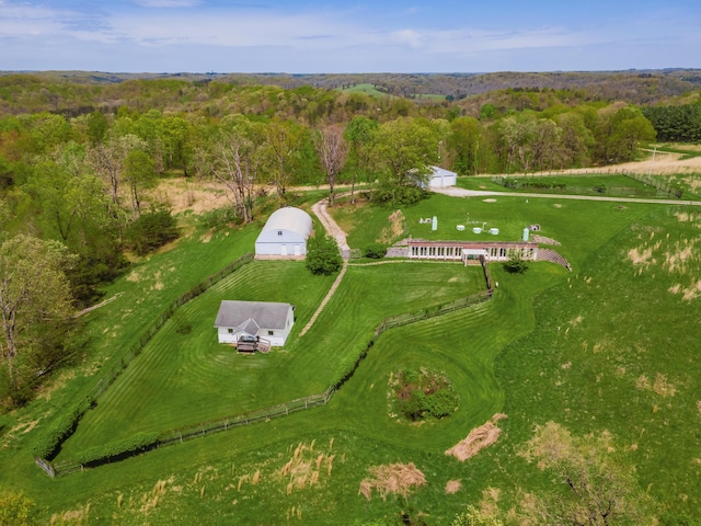 birds eye view of property with a rural view