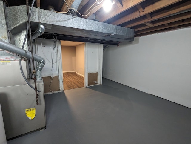 basement featuring heating unit