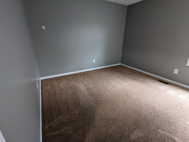 spare room with carpet floors