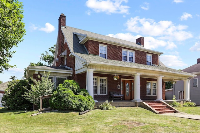 view of front facade with a front lawn and a porch