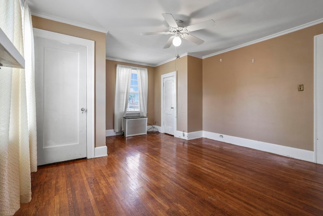 empty room with dark hardwood / wood-style floors, ceiling fan, and ornamental molding