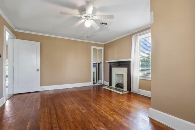 unfurnished living room featuring ceiling fan, ornamental molding, and hardwood / wood-style flooring