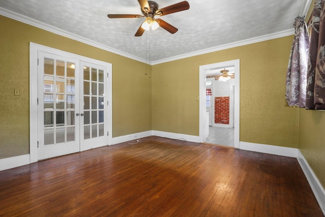 empty room with hardwood / wood-style floors, french doors, ornamental molding, and ceiling fan