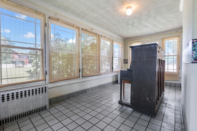 sunroom / solarium with plenty of natural light and radiator