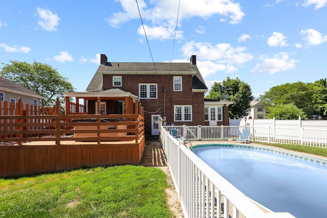 view of swimming pool featuring a deck