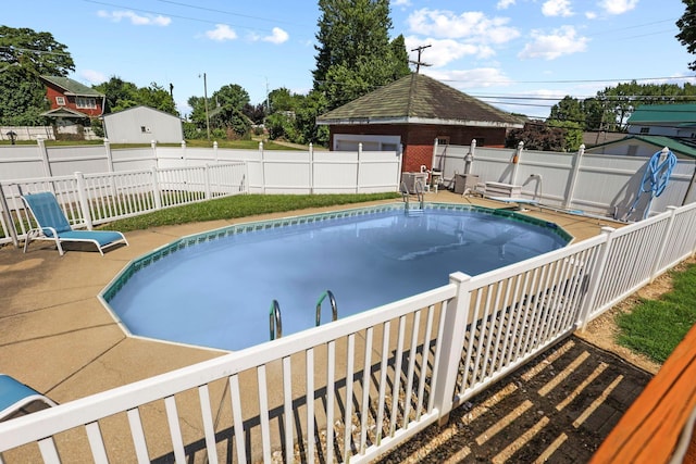 view of swimming pool with a patio area