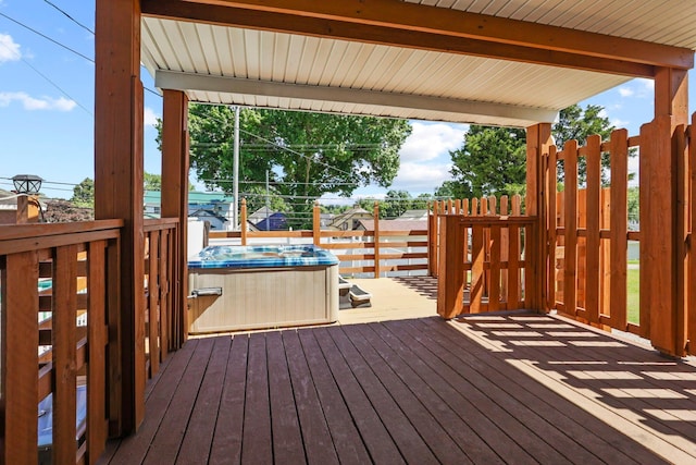 wooden terrace with a hot tub